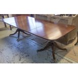 DINING TABLE, Georgian style mahogany with two centre leaves on twin pedestals and brass castors,