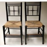 SUSSEX SIDE CHAIRS, a pair, 19th century, black painted, crossed backs and rush seats.