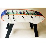 TABLE FOOTBALL, orange bound, black and white, of typical form, 147cm x 90cm H x 72cm D.