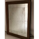 WALL MIRROR, rectangular sectioned antique style mirror within a broad moulded oak frame,