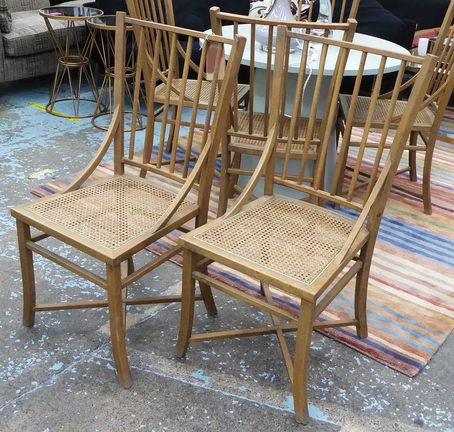 OKA CHAIRS, a set of six with caned seats, each 46cm W x 100cm H.