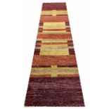 CONTEMPORARY TIBETAN ART DECO DESIGN RUNNER, 305cm x 85cm, hand knotted wool.