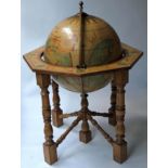 GLOBE COCKTAIL CABINET, in the form of an antique globe on stand with rising lid,