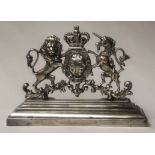 ROYAL COAT OF ARMS, silvered metal on stand, 22cm H x 31cm.