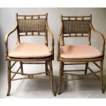 REGENCY FAUX BAMBOO ARMCHAIRS, a pair, painted with cane panelled seats and backs.