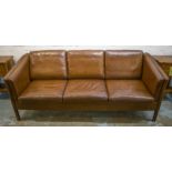 STOUBY DANISH SOFA, 1970's design teak and soft grained leather upholstered with seat,