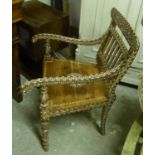 OPEN ARMCHAIR, Indian rosewood, ebony and bone inlaid on turned front supports, 54cm W x 93cm H.