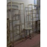 ETAGERES, a pair, 1960's French style, gilt metal with glass shelves, 62cm x 26cm x 164cm.