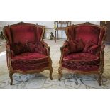 BERGERES, a pair, Louis XV style walnut in red velvet with seat and scatter cushions, 96cm H x 78cm.