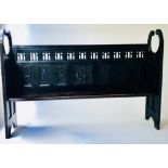 SCOTTISH BENCH, 19th century Glasgow school ebonised with carved and pierced panelled back,