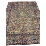 FINE ANTIQUE PERSIAN KIRMAN LAVER CARPET, 355cm x 265cm, millefleur design.