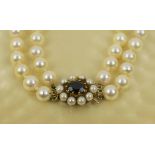 DOUBLE STRAND CULTURED PEARL NECKLACE, 1920's, with gold, garnet and pearl cluster clasp,