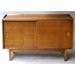 G W EVANS SIDEBOARD BY IAN AUDSLEY, mid 20th century walnut and elm with sliding doors,