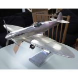 MODEL SPITFIRE, on stand, polished metal finish, stands at 41cm H.