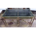 MAISON JANSEN STYLE COCKTAIL TABLES, a nesting set of three, gilt metal and glass,