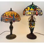 TIFFANY STYLE LAMPS, two, dragonfly design, largest 57cm H.