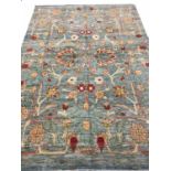 FINE BOULO OUSHAK CARPET, 290cm x 208cm, palmette and vine design on a duck egg blue field.