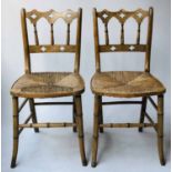 SIDE CHAIRS, a pair, Regency Strawberry Hill Gothic pierced fruitwood and rush seats.