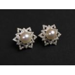 PEARL AND DIAMOND EARRINGS, a pair, in pierced star settings (clip on).