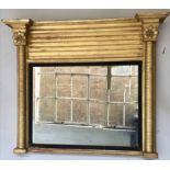 REGENCY OVERMANTEL, early 19th century giltwood the rectangular plate within an ebonised slip,