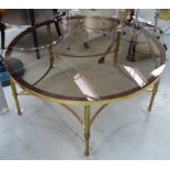 MAISON JANSEN STYLE COCKTAIL TABLE, vintage 20th century gilt metal, glass top, 92cm diam x 42cm H.