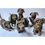 RATTAN DOGS, a group of seven, rattan work dogs with bead eyes and various poses, 50cm at tallest.