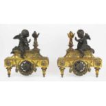 CHENETS, a pair, 19th century French patinated and gilt metal with cherub and Flambeau mounts,
