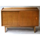 G W EVANS SIDEBOARD BY IAN AUDSLEY, mid 20th century walnut and elm with sliding doors, incised wave