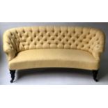 VICTORIAN SOFA, yellow silk upholstered and concave fronted with deep button back and aesthetic