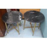 SIDE TABLES, a pair, 1960's Italian style, black marble tops, 43cm diam x 45cm H. (2)