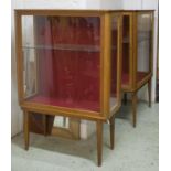 DISPLAY CABINETS, a pair, mid 20th century mahogany, each with a door to both ends and adjustable
