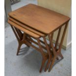 NEST OF THREE TABLES, circa 1960, teak with bowed rectangular tops, largest 53cm H x 56cm W x 36cm