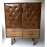COCKTAIL CABINET, 1970's oak with two buttoned leather doors and lined shelved interior above six