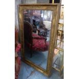 WALL MIRROR, French Empire giltwood and gesso with rosette and anthemion decorated frame around a