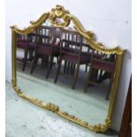 WALL MIRROR, in a shaped gilt frame, 135cm 115cm H.