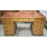 PEDESTAL DESK, Victorian oak with old worn red leather top above nine drawers on castors, 76cm H x