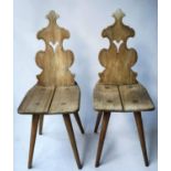 CAPELIA CHAIRS, a pair, mid 20th century ash continental with pierced backs and splay supports. (2)
