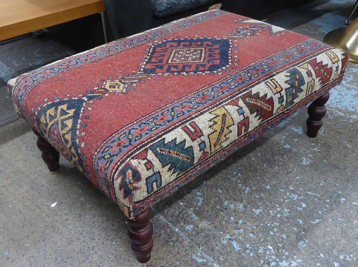 FOOTSTOOL, English country house style, upholstered in a vintage carpet, on turned supports, 63cm