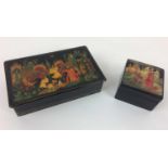 PALEKH BOXES, two, Russian lacquer decorated with religious iconography, largest 17cm x 10cm. (2)