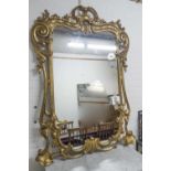 WALL MIRROR, Victorian giltwood, circa 1850, with scrolled and carved detail to the frame, 170cm H x