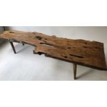 LOW TABLE/BENCH, in the manner of Reynolds of Ludlow, single piece with yew tree section raised upon