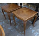 SIDE TABLES, a pair, early 20th century French walnut with shaped tops above carved friezes on