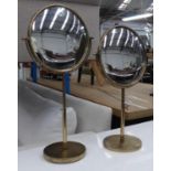 CONVEX VANITY MIRRORS, a pair, on adjustable stands, articulating mirrors, 62cm at tallest. (2)