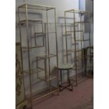 ETAGERES, a pair, 1960's French style, gilt metal with glass shelves, 62cm x 26cm x 164cm. (2)
