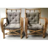 LOUNGER ARMCHAIRS, a pair, 1950's bamboo and cane bound with wing backs, broad curved arms and