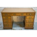 PEDESTAL DESK, Victorian walnut, circa 1890, with tan leather top above nine drawers on castors,