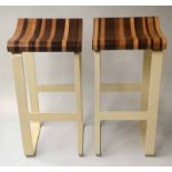 BAR STOOLS, a pair, with shaped specimen wood seats and painted metal supports, 79cm H. (2)