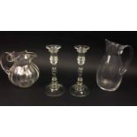 CANDLESTICKS, a pair, moulded glass, 24cm H and two water jugs including one Baccarat. (4)
