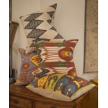 RIFAT IKAT SILK CUSHIONS, a group of four, various designs. (4)