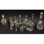 COLLECTION OF SCENT BOTTLES, various cut glass with silver collars, fifteen in total, 22cm H. (15)